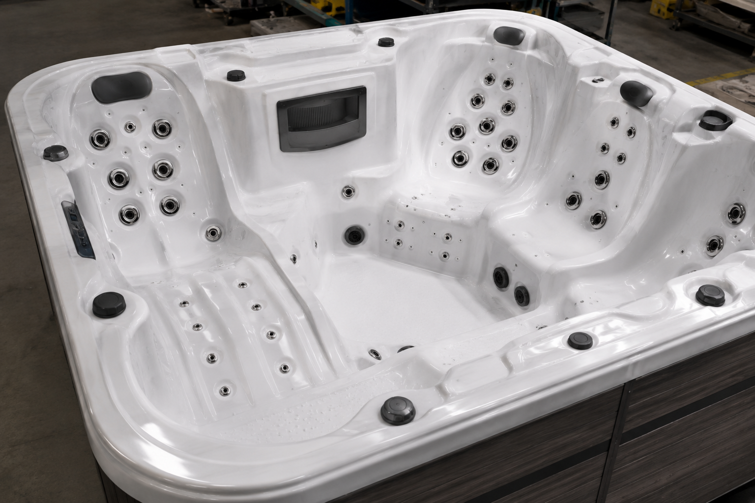 White hot tub with multiple jets on a wooden floor